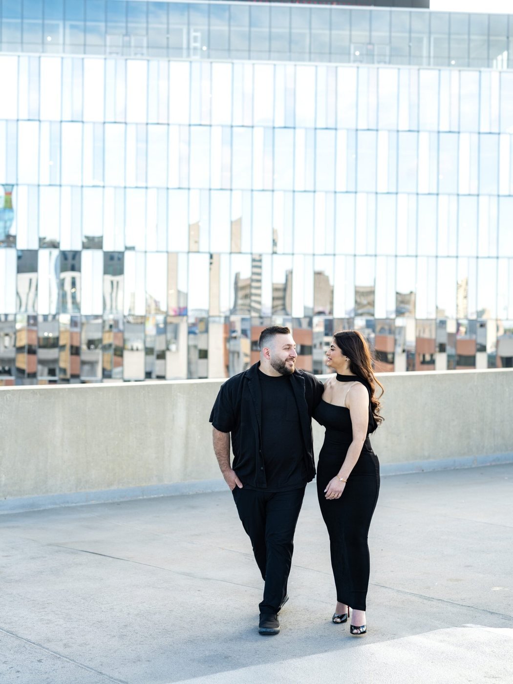 Couple on a rooftop against the skyline