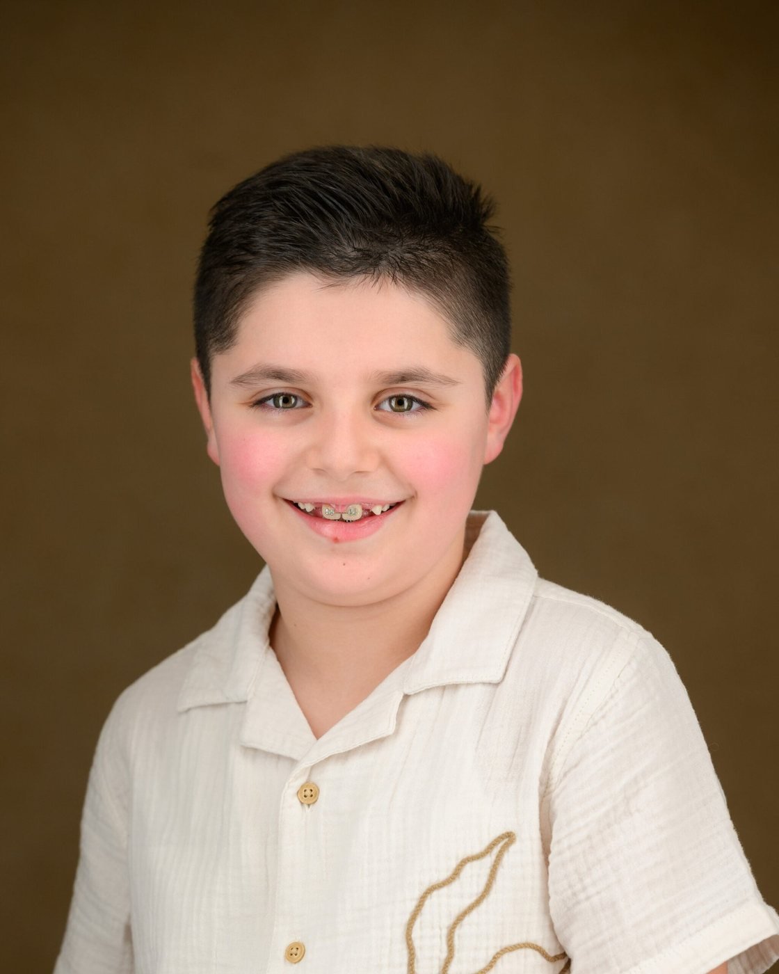 School portrait on a classic painted backdrop