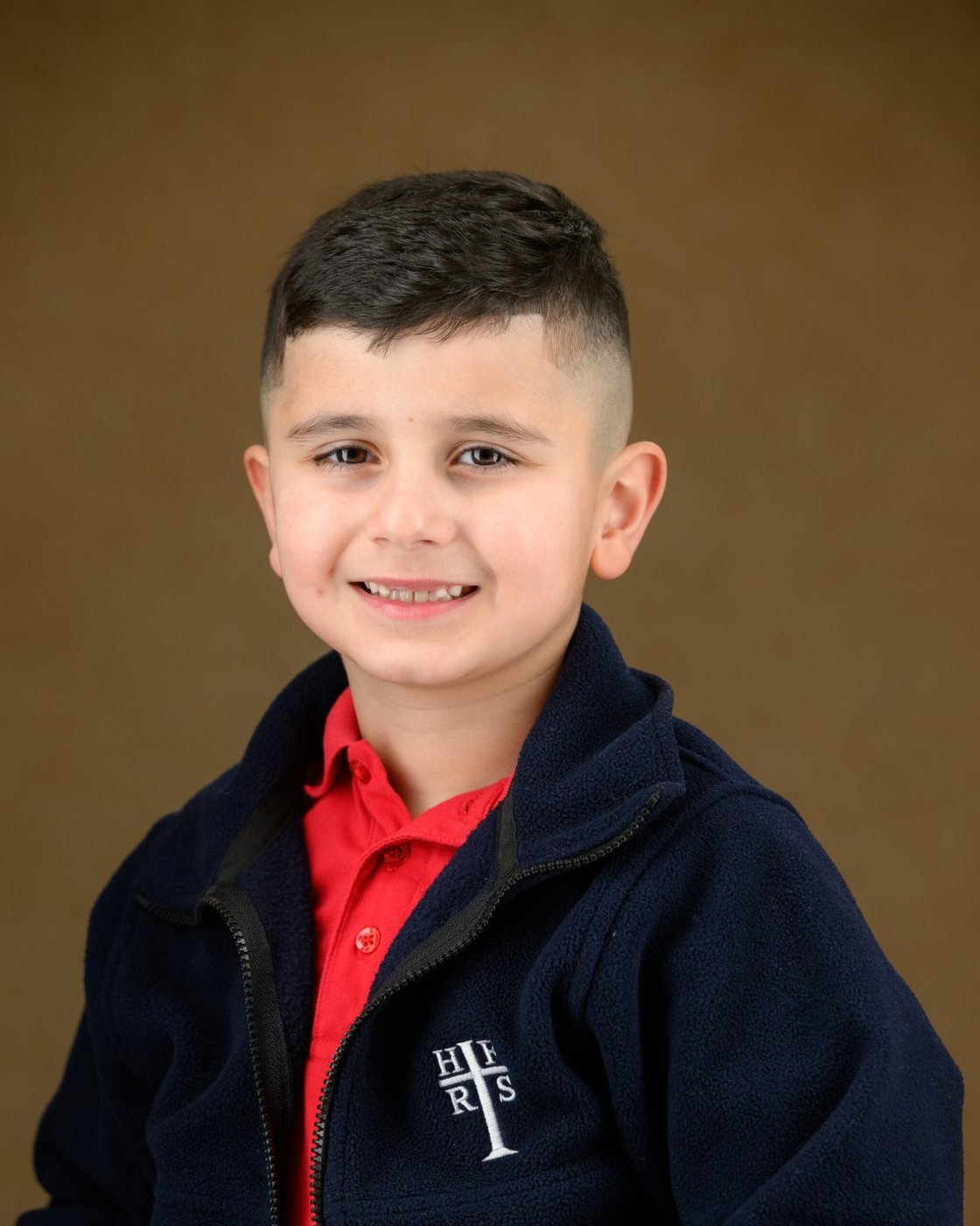 School portrait on a classic painted backdrop