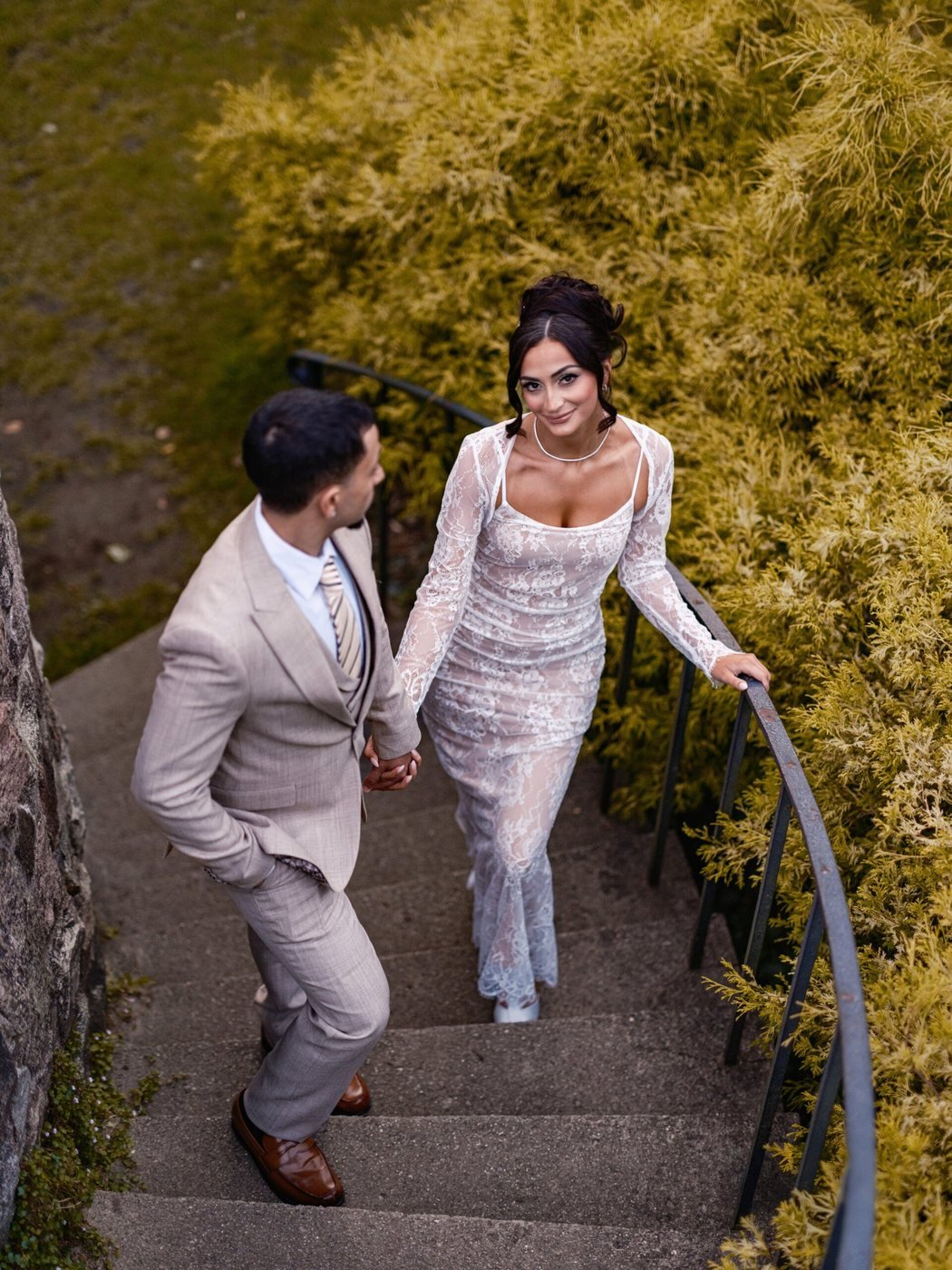 Couple climbing stone stairs in autumn