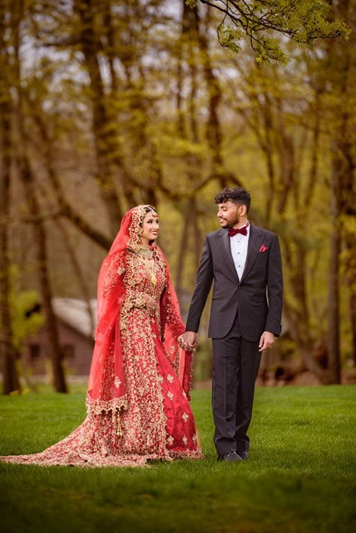 Couple in traditional dress among autumn trees