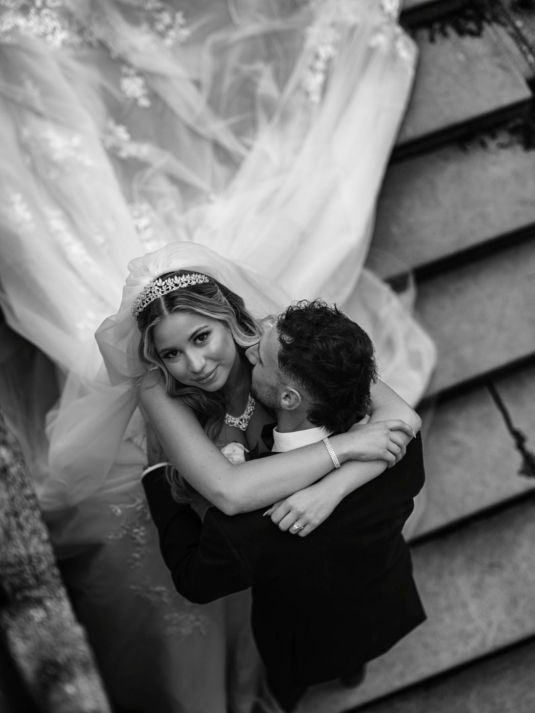 Couple embracing under the veil, black and white
