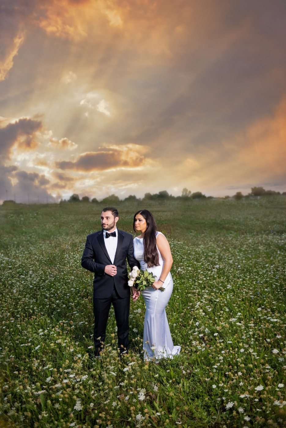 Couple in a wildflower field at golden hour