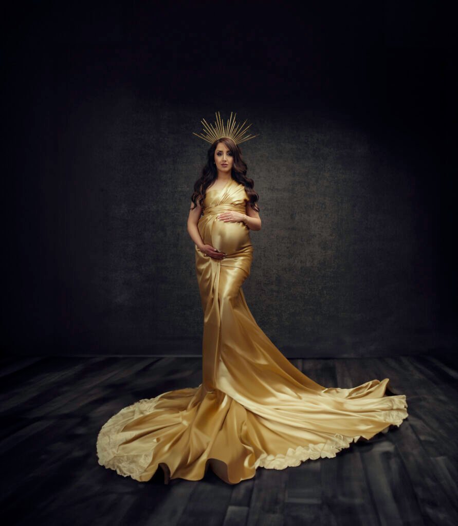 Elegant maternity portrait in golden gown photographed by Timeless Moments Studio